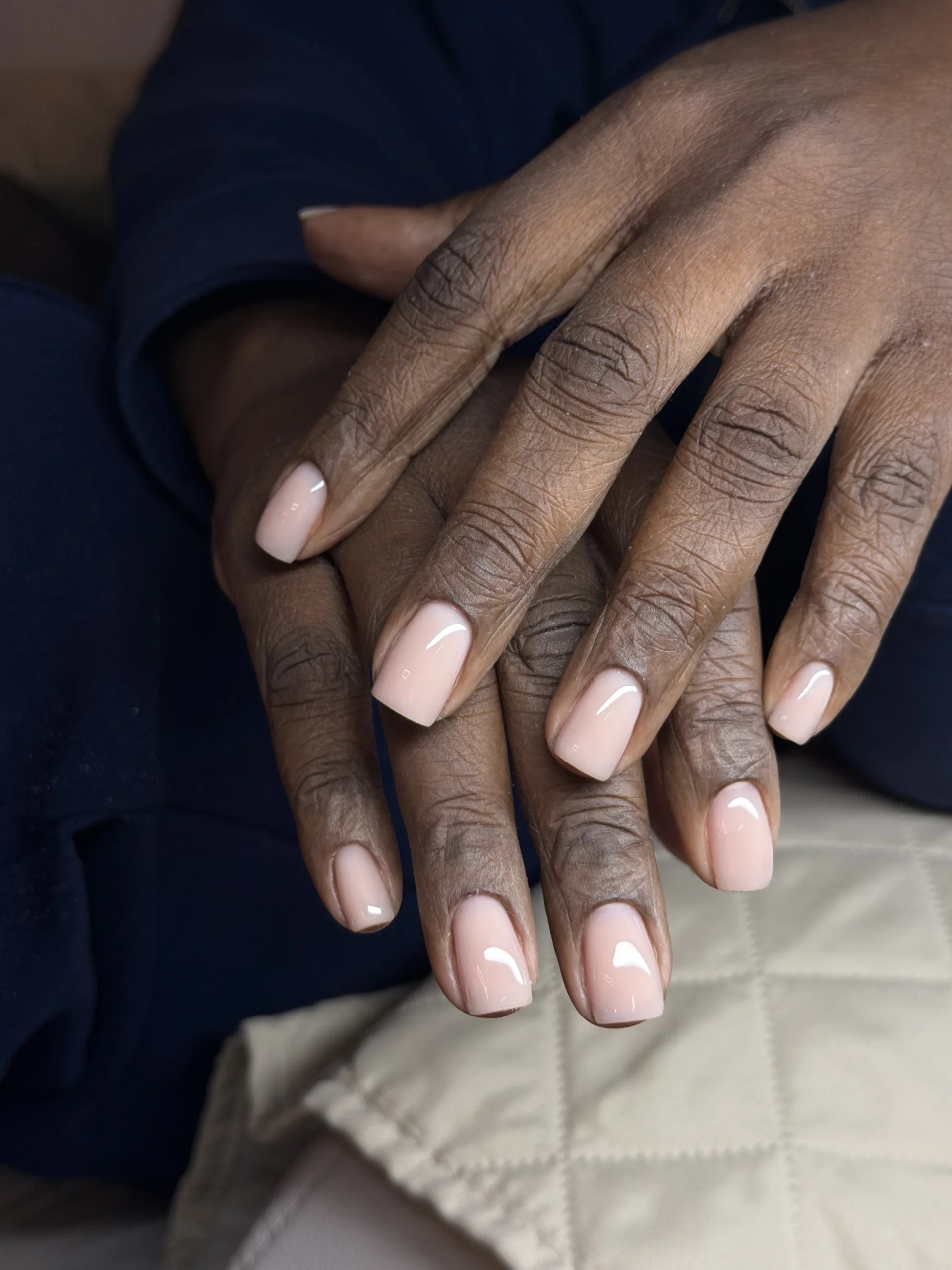 Natural-looking glossy nude pink Russian manicure