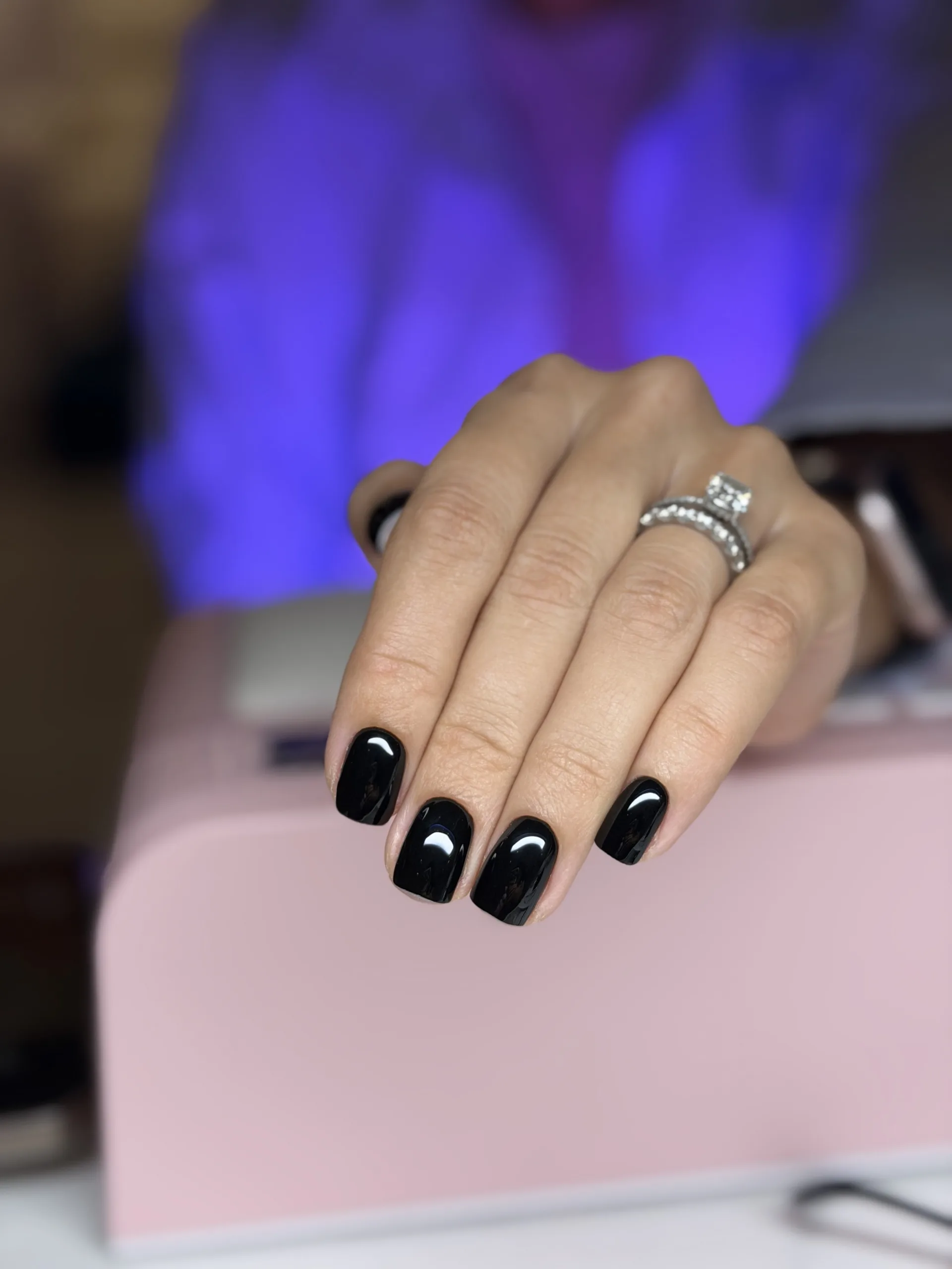 Short glossy black gel manicure
