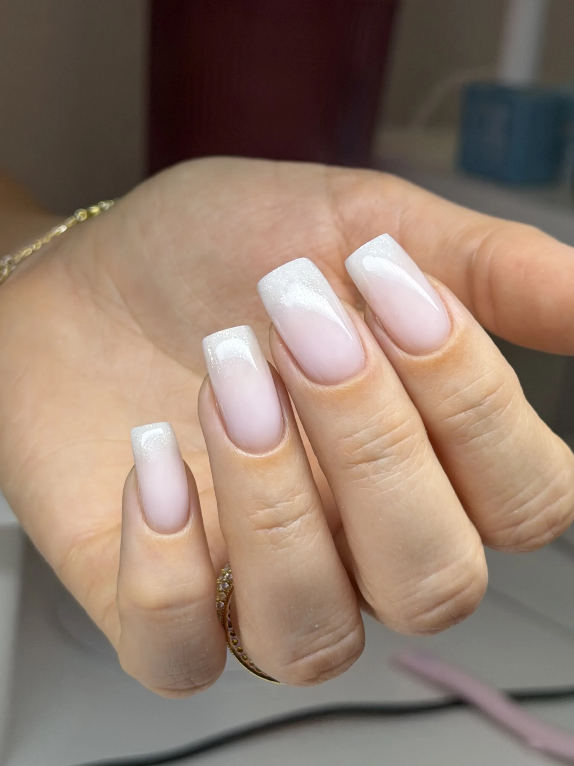 Soft pink nails with shimmering white French tips