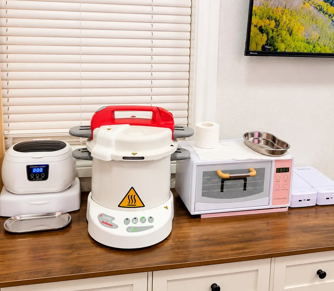 Autoclave sterilization equipment at ByKris Beauty Lab in Downtown Plano, Texas