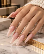 Long glossy nude pink gel nail extensions with a tapered square shape, Russian manicure at ByKris Beauty Lab